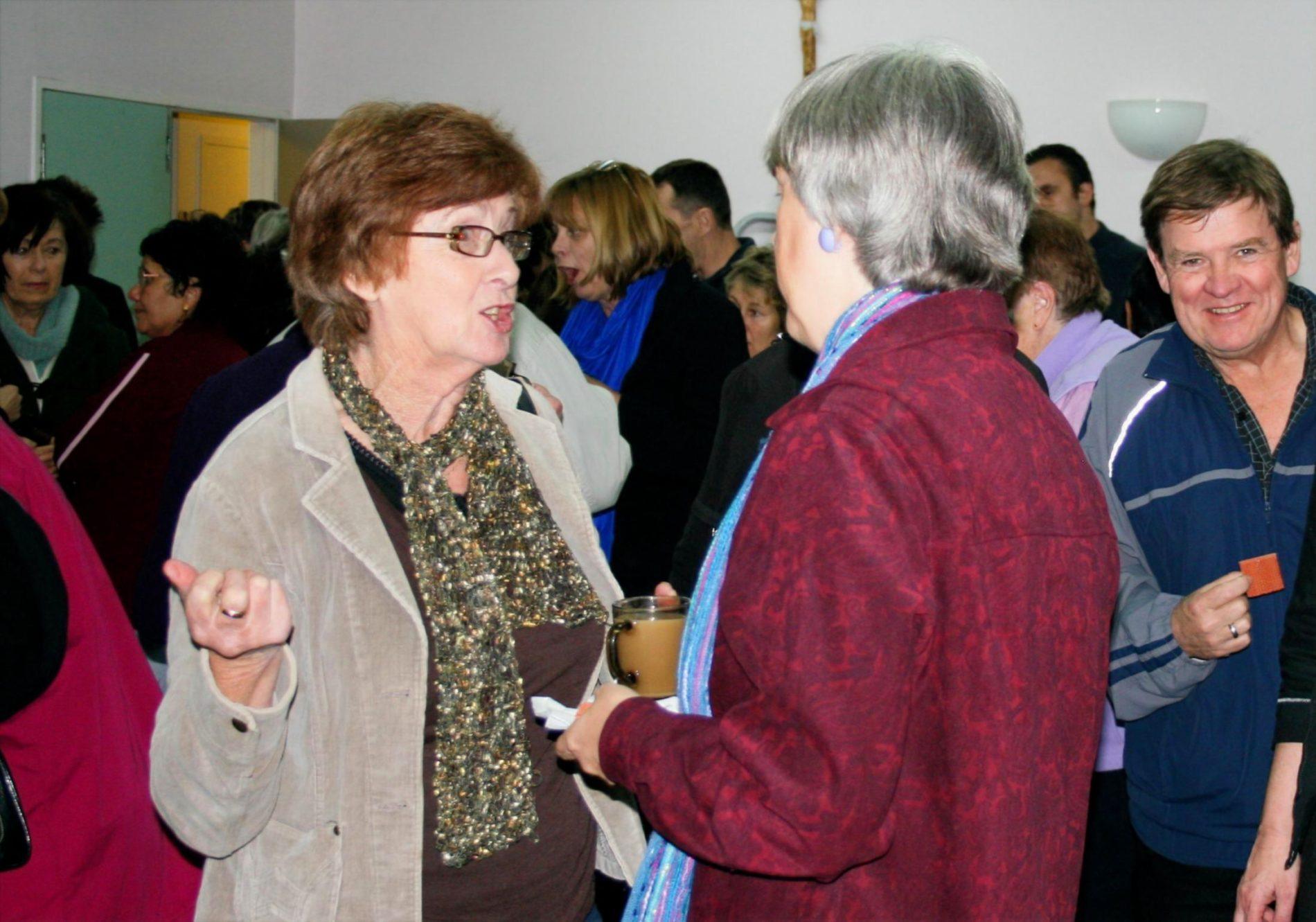 Terry Modica listening to a woman who attended her seminar