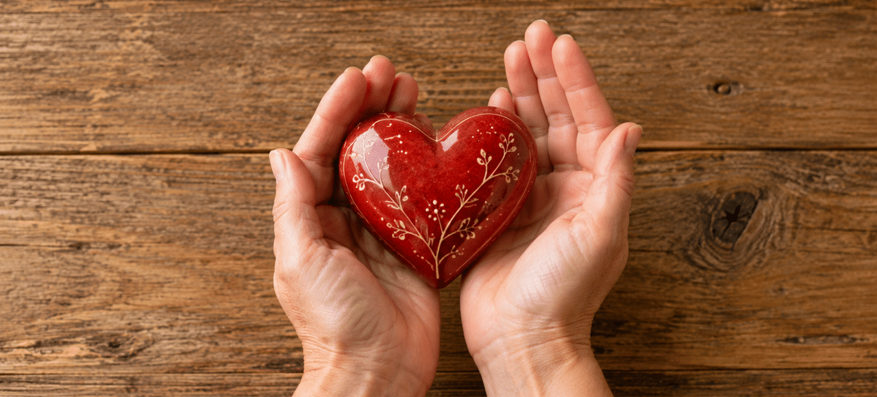 hands holding a red heart for a difficult marriage